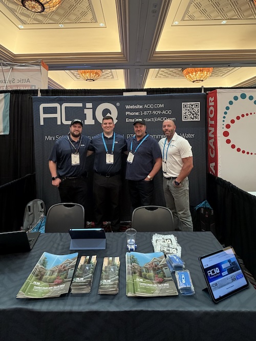 ACiQ team at HVAC trade show discussing best HVAC software and contractor solutions