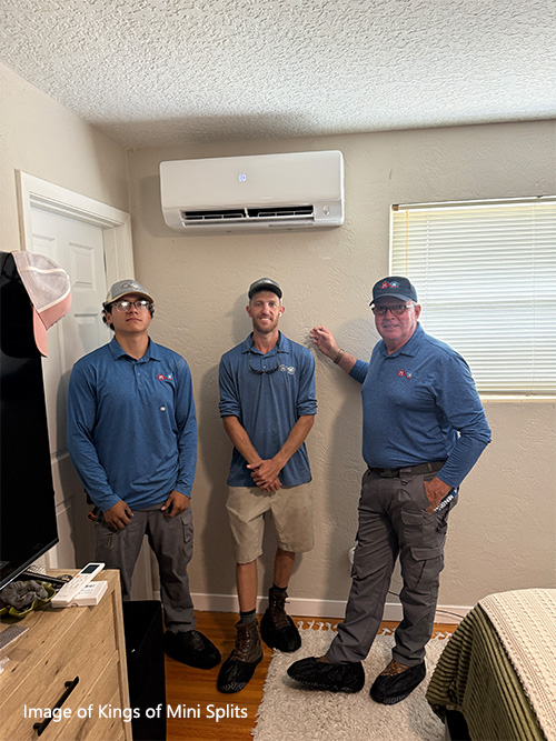 Kings of Mini Splits team standing below installed mini split system inside home after installation