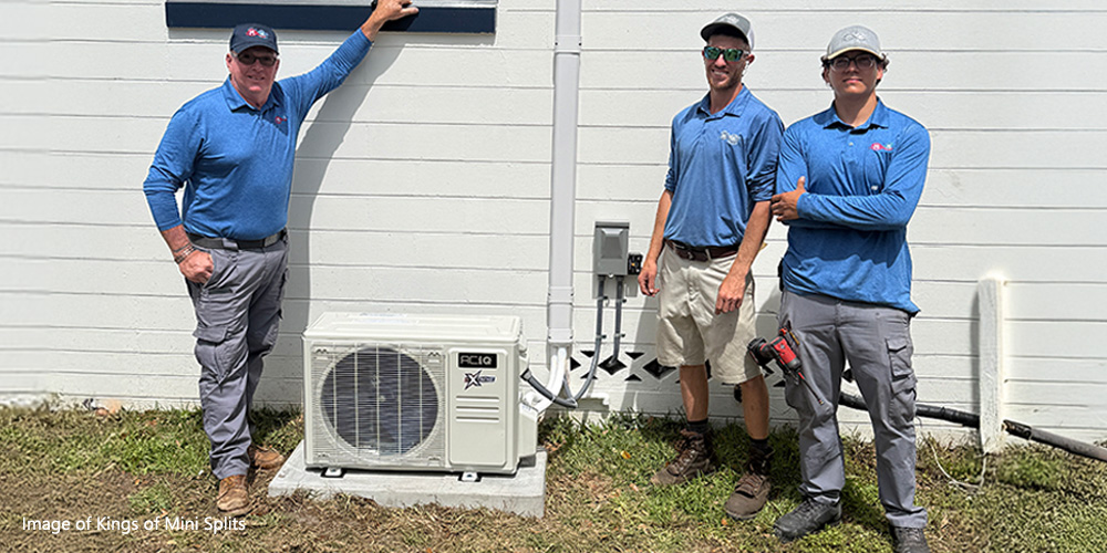 HVAC technicians from Kings of Mini Splits standing next to installed ACiQ mini split outdoor condenser unit