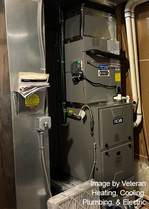 ACiQ indoor HVAC equipment installed with ductwork and condensate piping